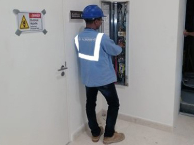 Al Maamoura technician inspecting the elevator cabinet